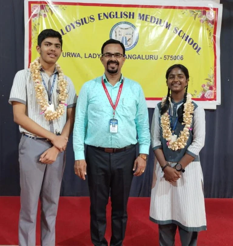 "Newly elected *SPL* - Pravijya, Class IX A. *ASPL* - Leston Sherwin D'Souza, Class VIIIA. For the academic year 2024-25, they have been honored during the assembly.  We congratulate them and wish them good luck in their tenure.
